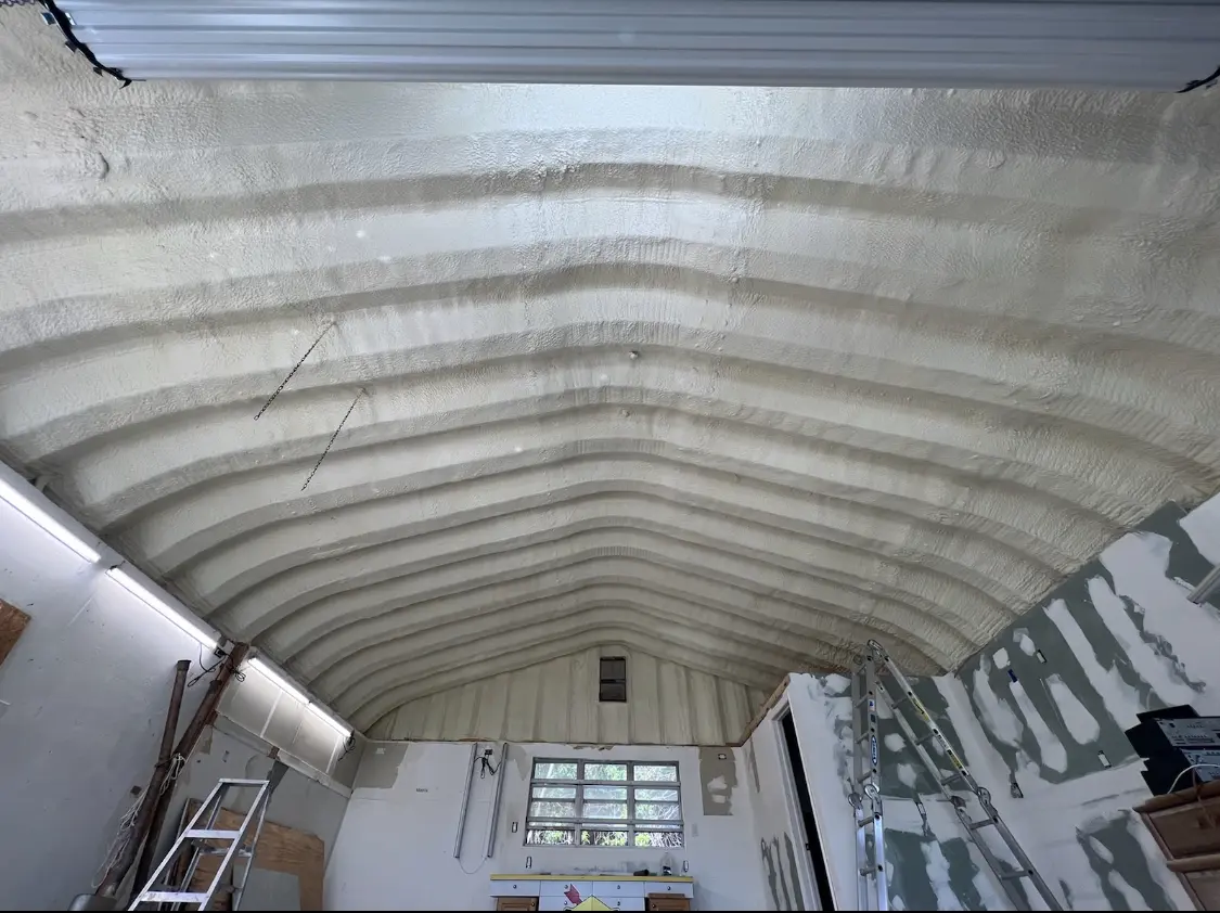 Spray polyurethane foam applied to the underside of a metal roof deck in Camino Tassajara